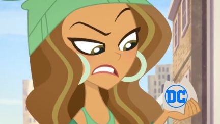 Jessica Cruz Green Lantern on DC Super Hero Girls looking at the DC logo (super imposed in her hand.) Image: DC, and edited by Alyssa Shotwell.