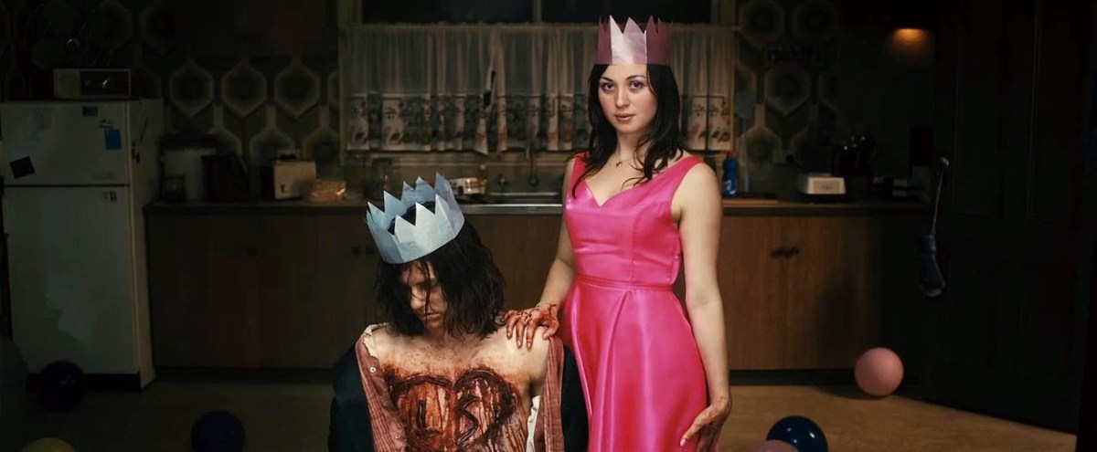 Lola posing with Brent in The Loved Ones