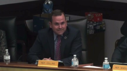 A white male politician speaks from his statehouse desk.