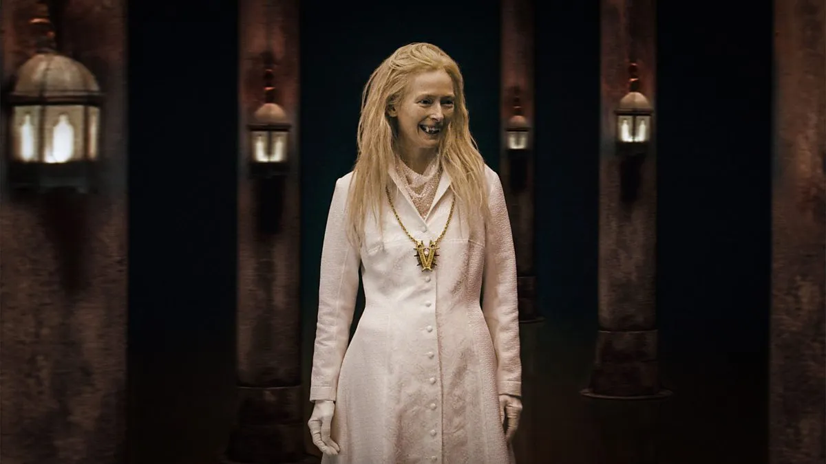 Tilda Swinton grins as a vampire in What We Do in the Shadows.