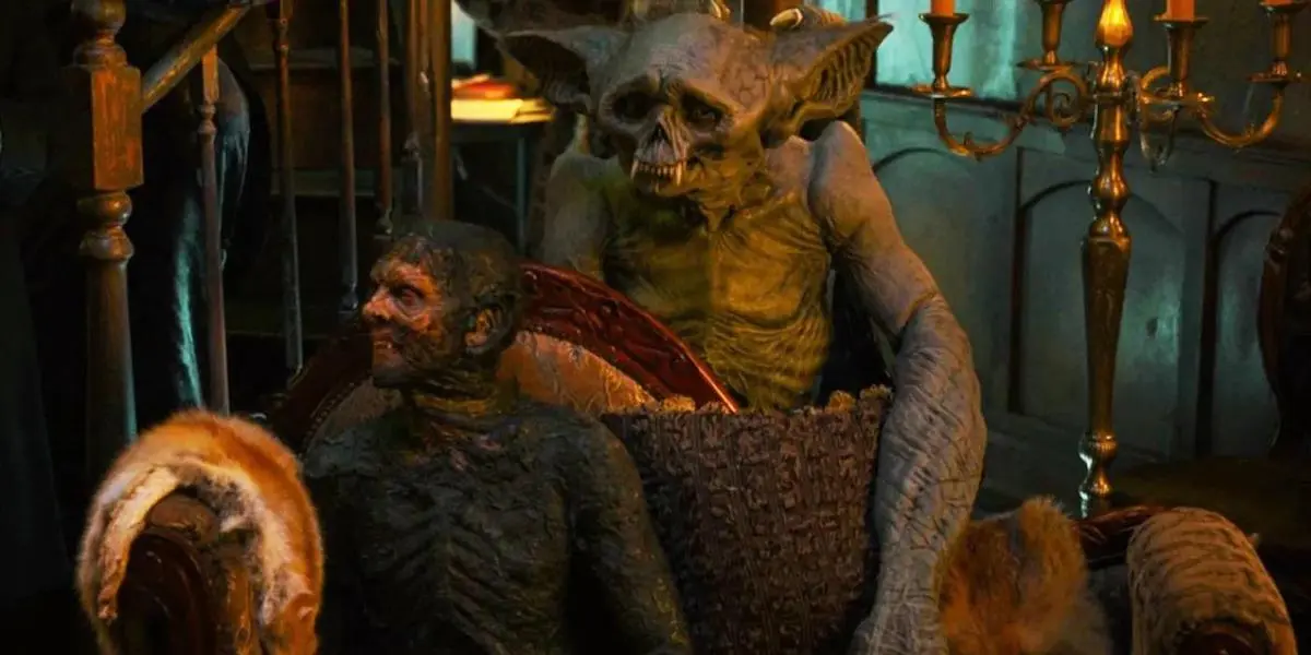 The Sire, a gargoyle-looking creature, sits in a large bucket.