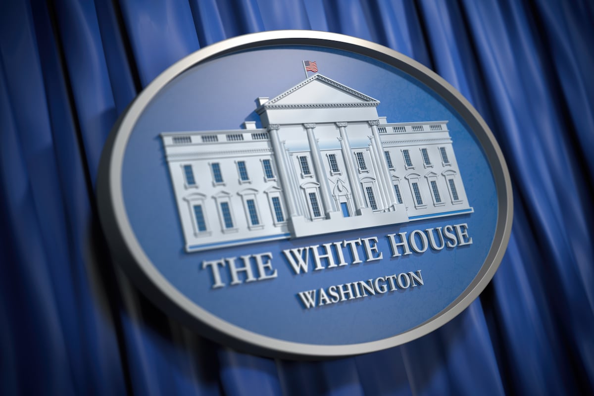 The White House Washington sign on blue background