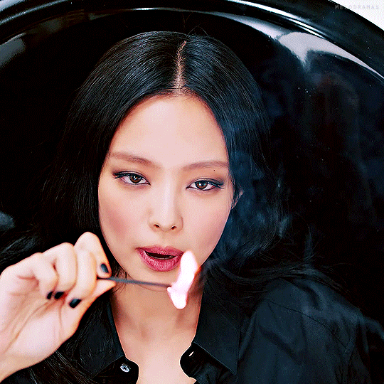 BLACKPINK's Jennie in the Shut Down music video during a reference to their previous title track Playing With Fire