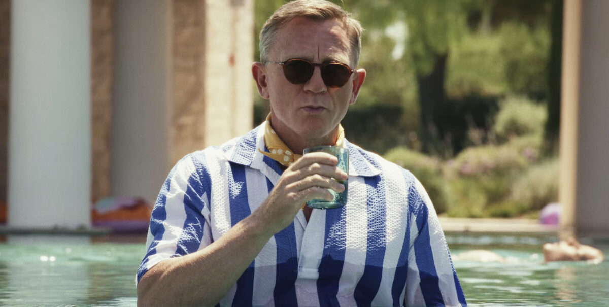 Daniel Craig as Benoit Blanc in a pool in Glass Onion: A Knives Out Mystery