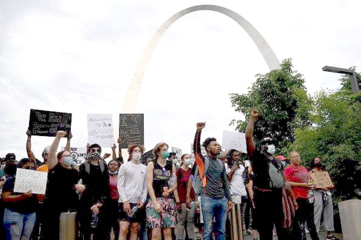 ResistSTL protesting in front of the St Louis arch