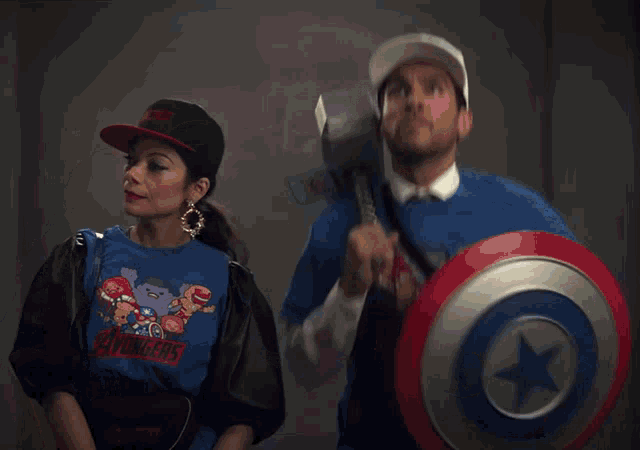 Animated gif of Nikki and Pug from She-Hulk, dancing in their Avongers T-shirts.