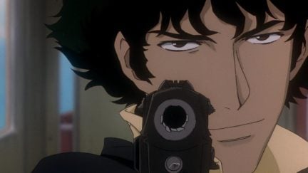 Spike aiming a gun at the camera with an intense look in 'Cowboy Bebop'