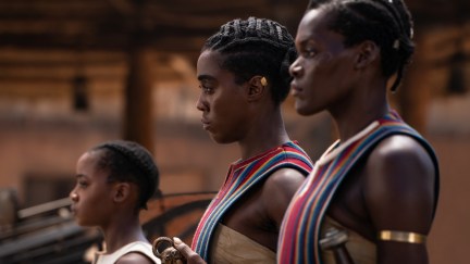 Women warriors stand in line in a still from The Woman King.