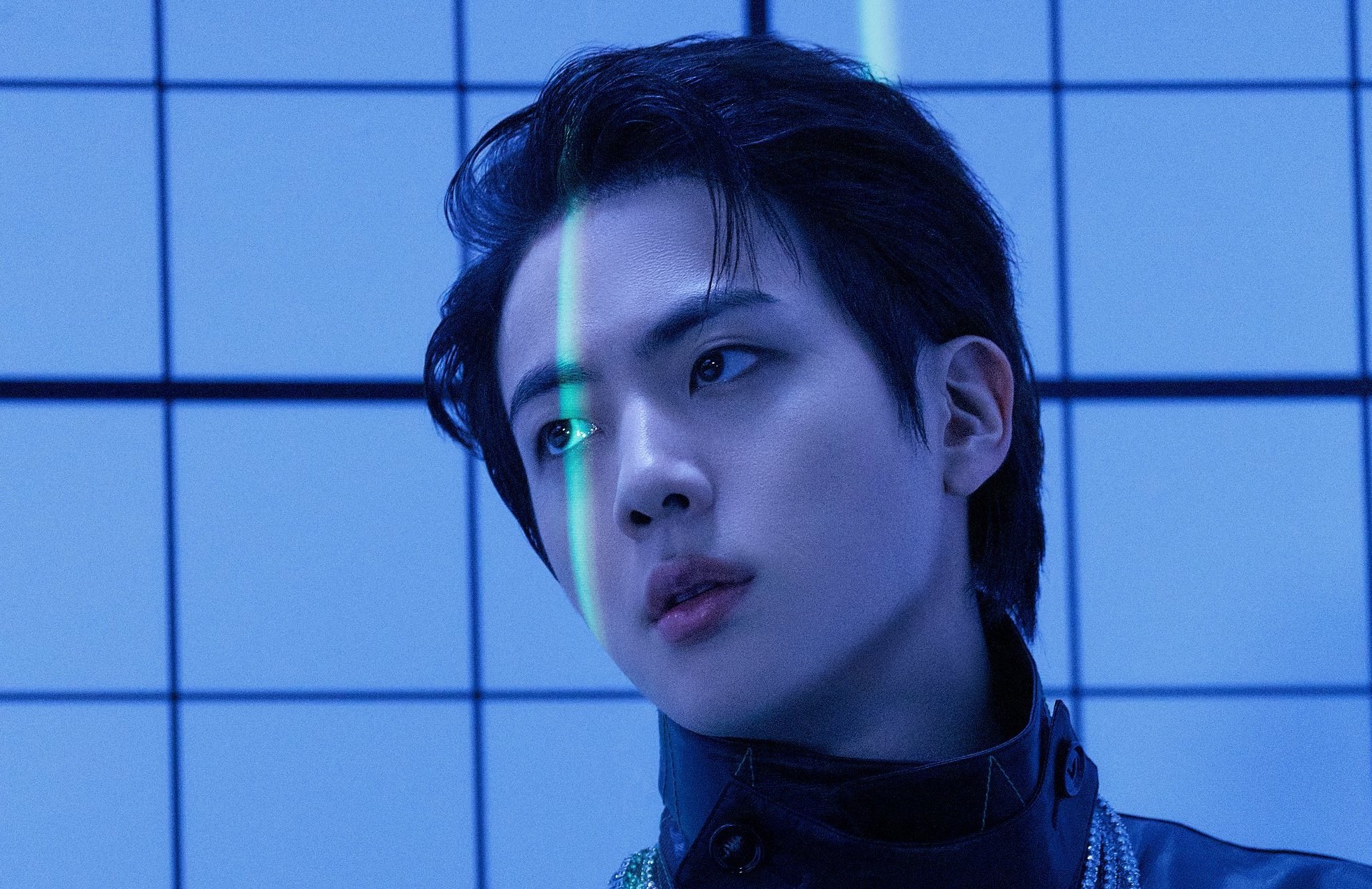 A picture of BTS's oldest member, Jin, in the concept photos for the group's anthology album Proof
