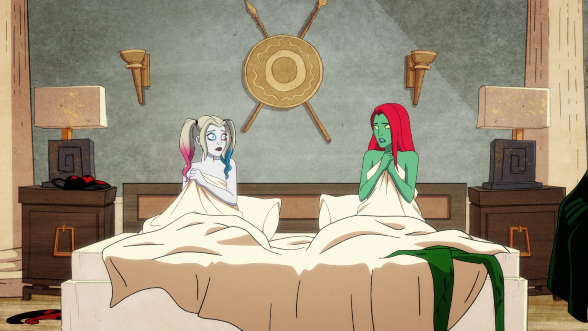 Harley and Poison Ivy tangles in the sheets of their bed seemingly annoyed at each other