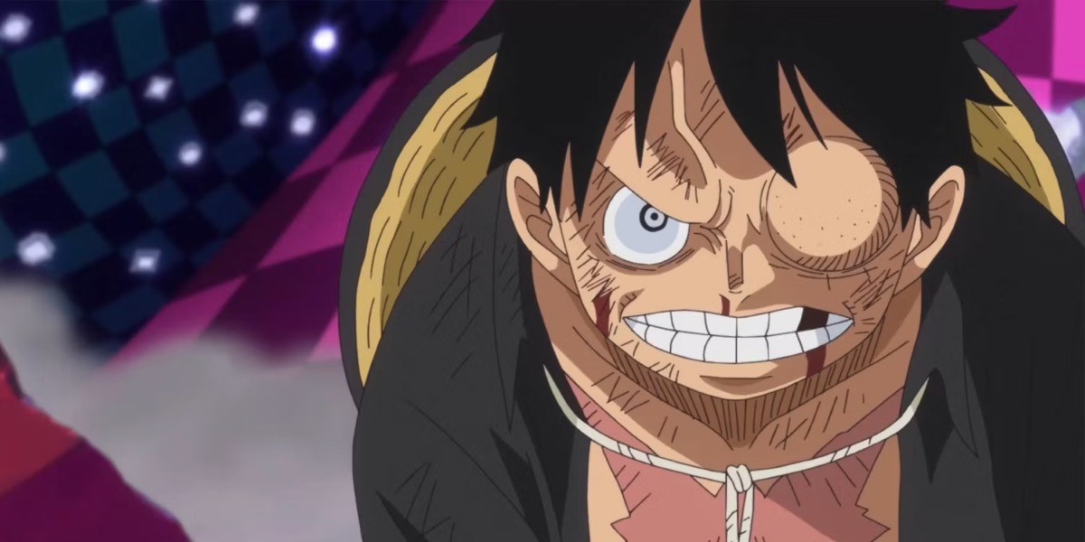 A beaten up Luffy glares furiously at his opponent in "One Piece"