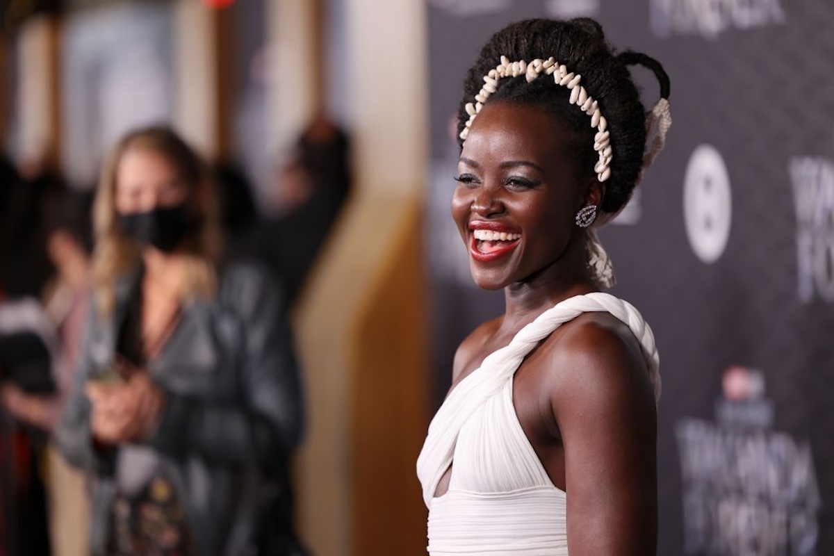 Lupita Nyong'o wears white at the Black Panther: Wakanda Forever world premiere.