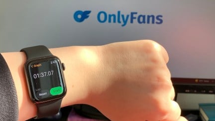 A woman wearing a watch while accessing OnlyFans. The time reads one minute, 37 seconds, and 7 milliseconds.