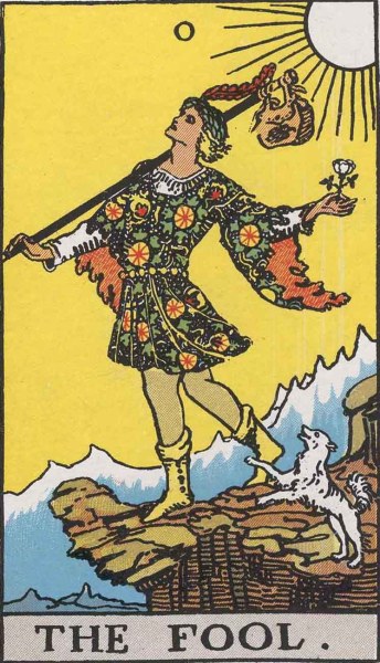 The Fool card from the Rider-Waite tarot. A figure appears to walk off a cliff, holding a bindle and followed by a white dog.