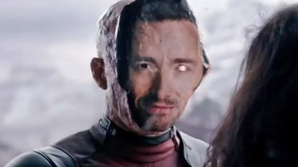Ryan Reynolds in Deadpool wearing a Hugh Jackman Mask