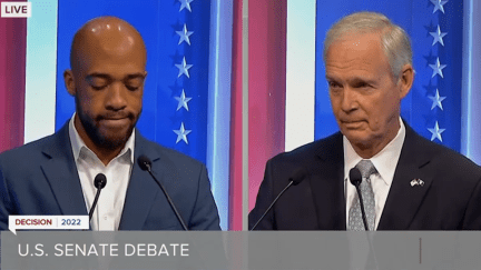 Mandela Barnes and Ron Johnson in split screen standing at podiums during a debate.