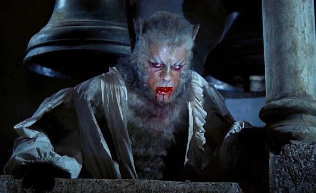 A werewolf with a bloody mouth emerges from the floor in "Curse of the Werewolf" 