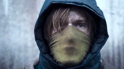 Jonas wears a face mask and hood on Netflix's original series 'Dark'