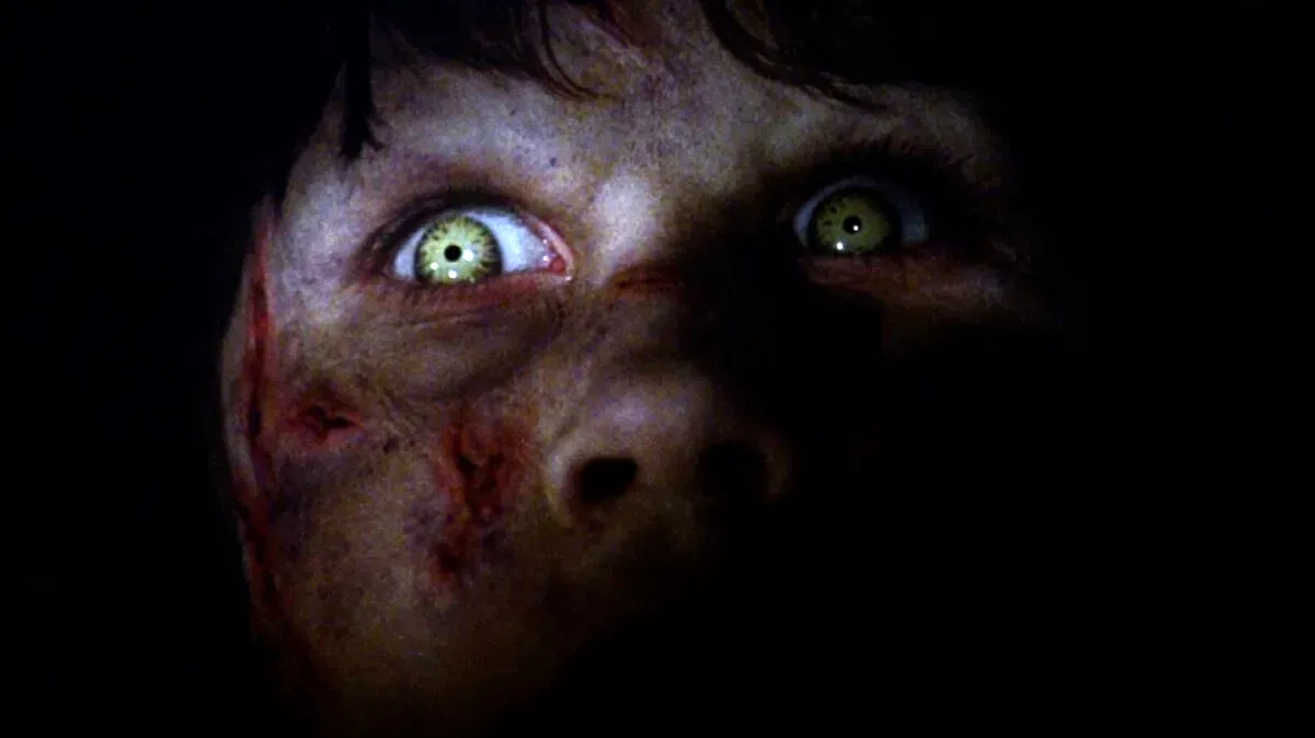 Regan's scary eye in the darkness in The Exorcist.