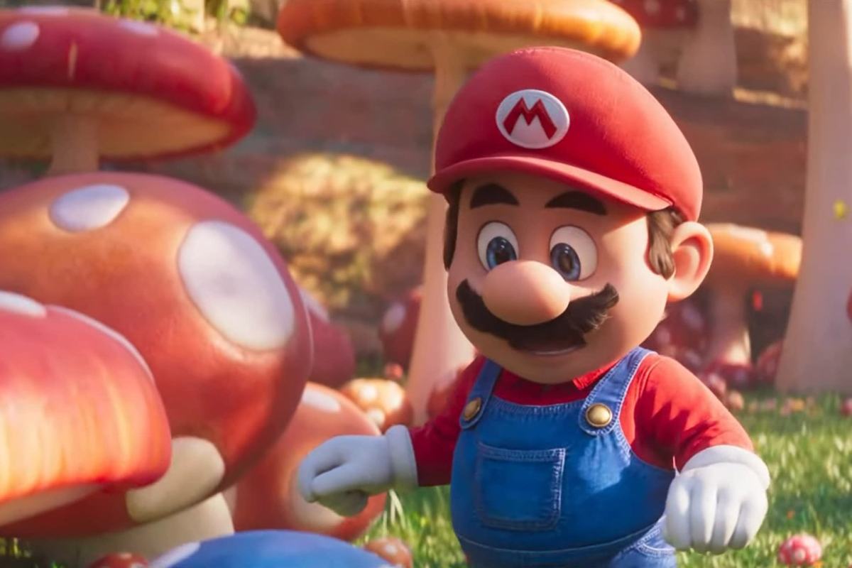 Mario, in the 2023 Super Mario Bros. Movie, looks at Toad in a mushroom patch.