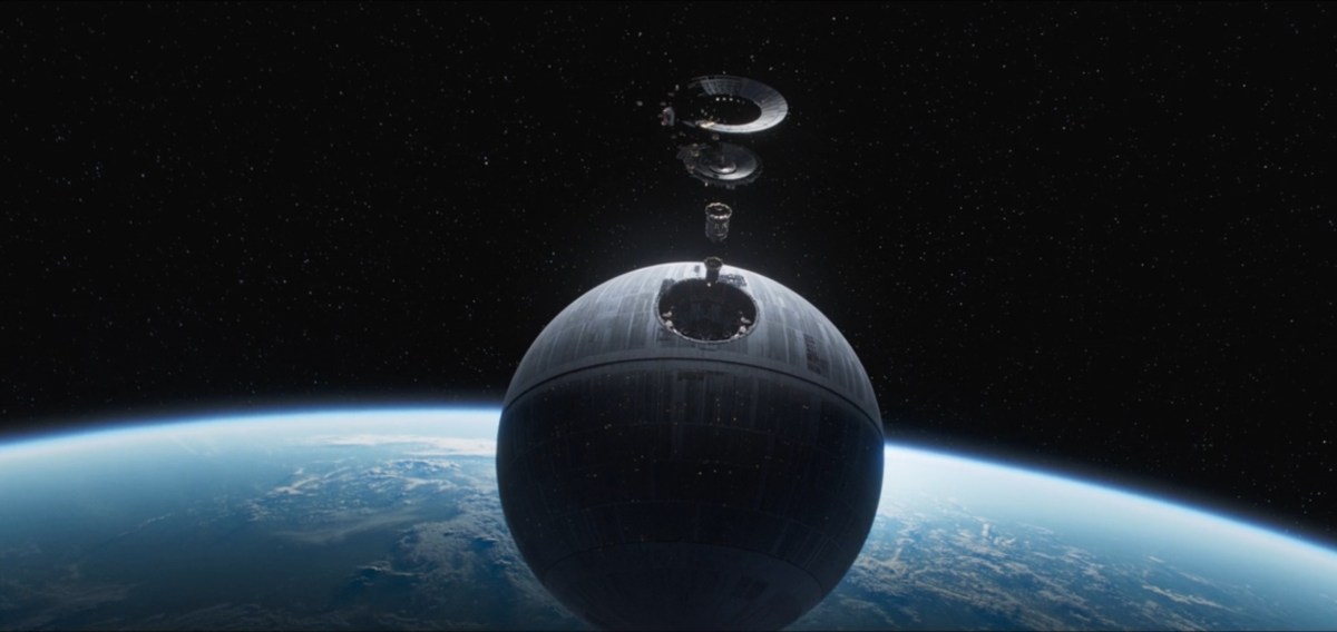The Death Star floats above a planet, with several discs arrayed above it.
