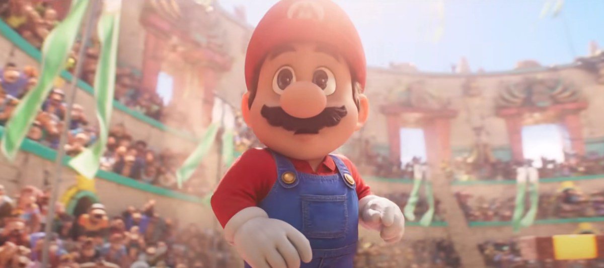 Mario stands in the middle of a stadium, looking intimidated by the crowd.
