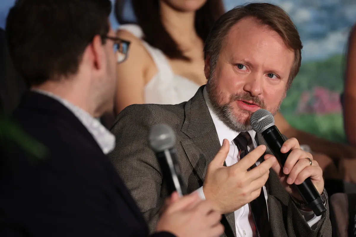 Rian Johnson with a microphone
