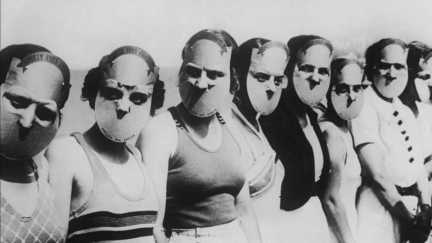a black and white photo of a row of ladies in horrifying masks that leave only their eyes uncovered