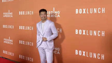 Simu Liu on the red carpet at the 2022 BoxLunch Holiday Gala.