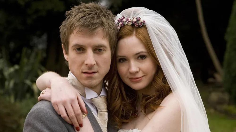 Arthur Darvill as Rory and Karen Gillan as Amy Pond in Doctor Who at their wedding. 