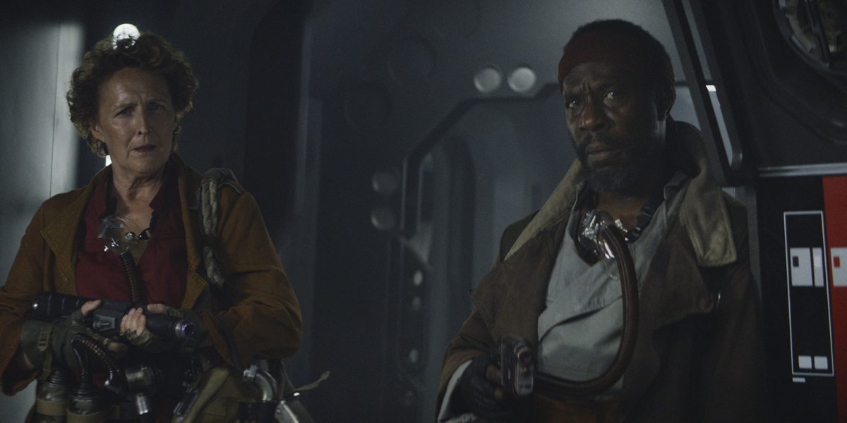 Maarva and Clem staring curiously at young Cassian