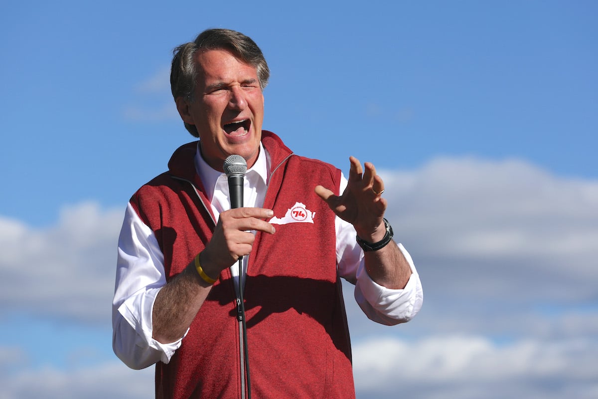 Glenn Youngkin squints and gestures while yelling at a campaign event.
