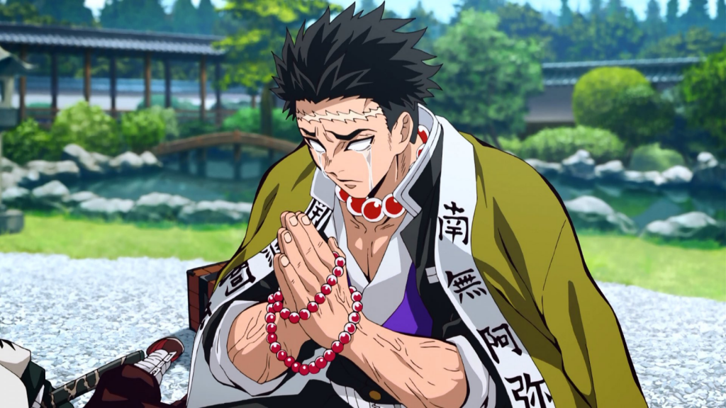 Gyomei crying with hands folded in prayer in Demon Slayer