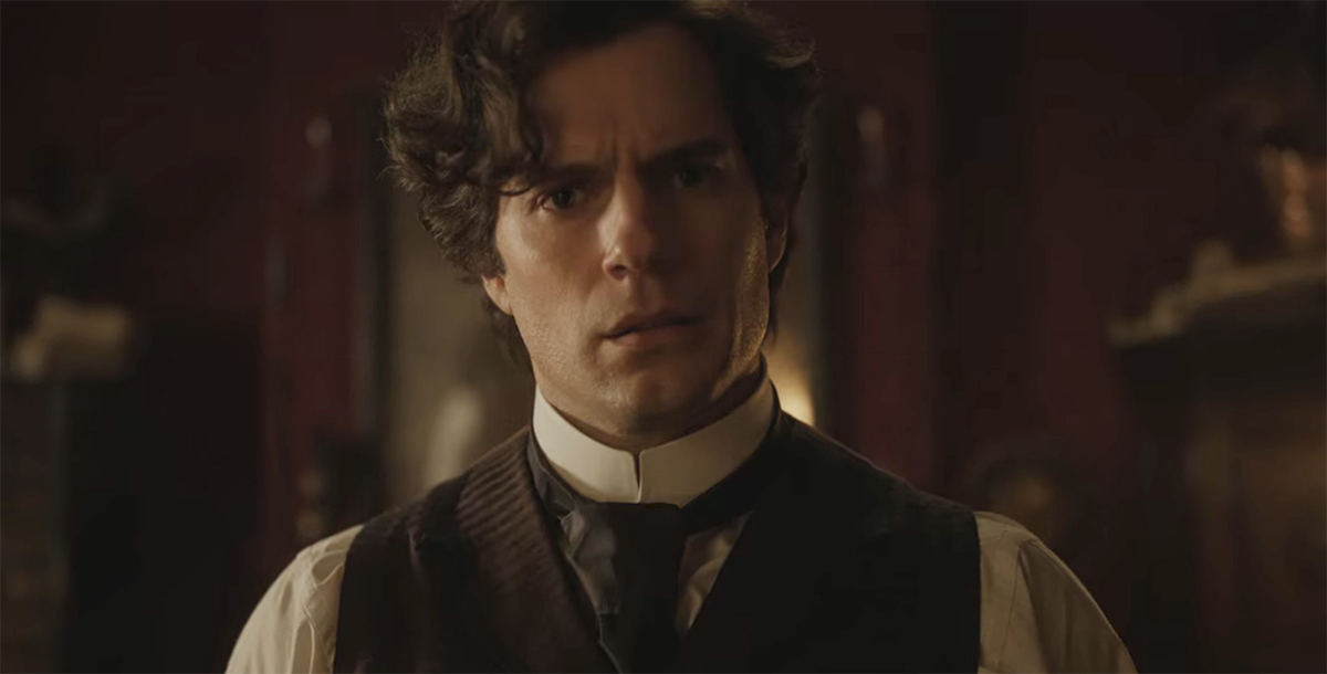 Henry Cavill as Sherlock looking at a puzzle in Enola Holmes 2