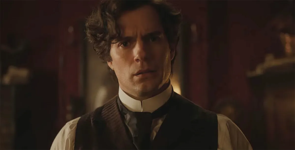 Henry Cavill as Sherlock looking at a puzzle in Enola Holmes 2