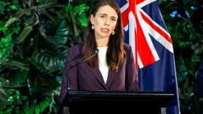 New Zealand Prime Minster Jacinda Ardern frowns while speaking at a press conference