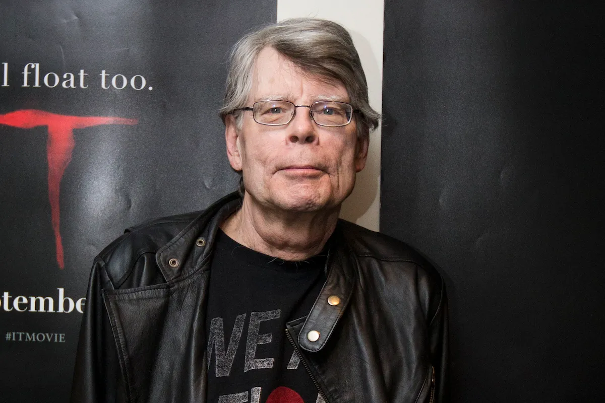 Stephen King gives a wry smile at the camera at an event for the movie It