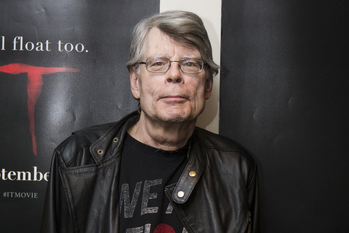 Stephen King gives a wry smile at the camera at an event for the movie It
