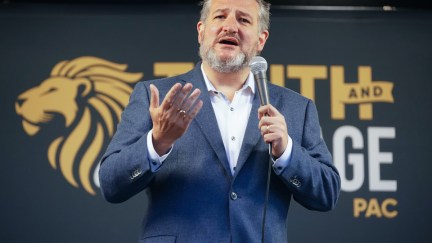 Ted Cruz speaks on stage at a political rally.