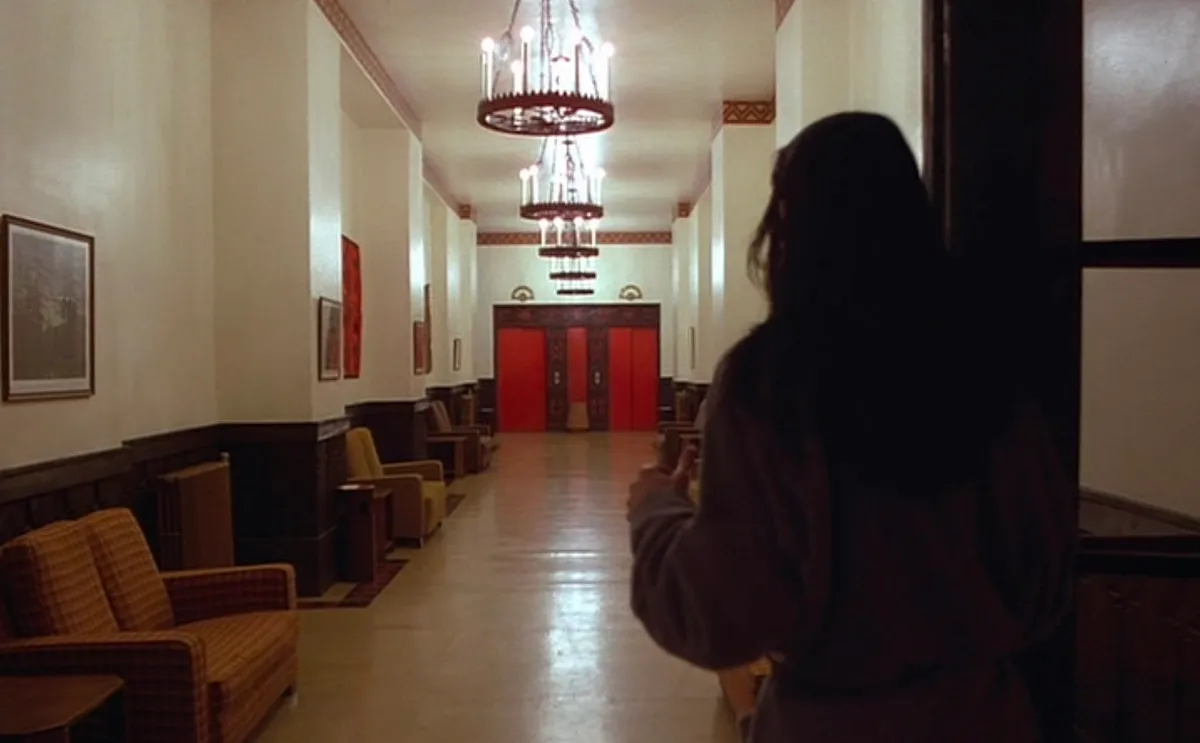 Shelley Duvall approaches the elevator in The Shining.