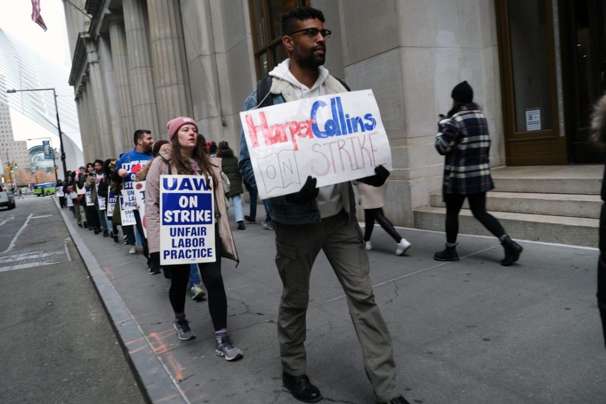 NEW YORK, NEW YORK - NOVEMBER 15: Employees of HarperCollins Publisher participate in a strike outside the company's offices in Manhattan on November 15, 2022 in New York City. The strikers, who work in a variety of departments at the company, have been bargaining for a union contract since December 2021. Salary, and a commitment to diversity and union security rights are some of the demands the workers have presented to the company. The union, Local 2110 of the UAW, represents more than 250 HarperCollins employees in the design, editorial legal, marketing, publicity, and sales departments. (Photo by Spencer Platt/Getty Images)