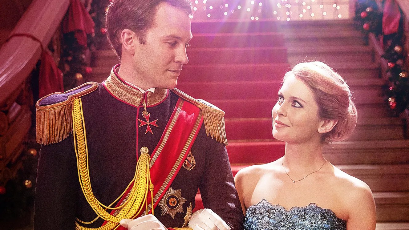 Rose McIver's Amber and Ben Lamb's Prince Richard walk arm-in-arm in a promo image for 'A Christmas Prince'