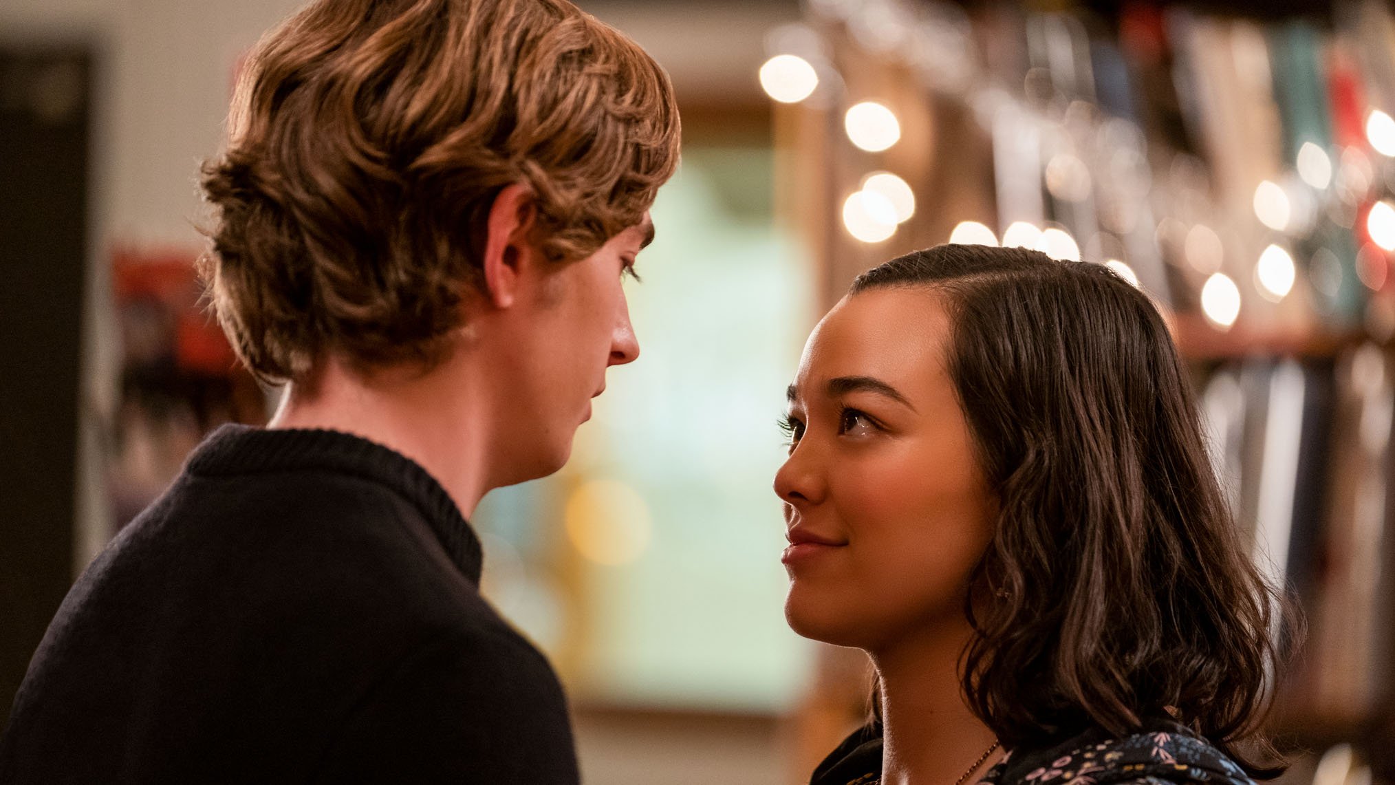 Dash (Austin Abrams) looks affectionately at Lily (Midori Frances) in the Netflix rom-com series ‘Dash & Lily’
