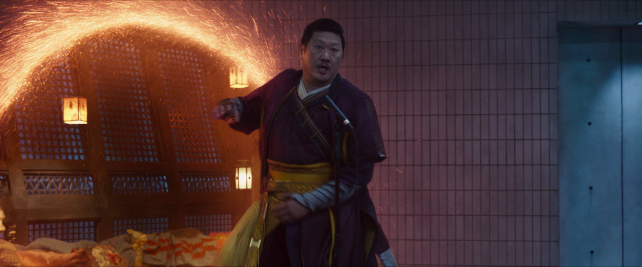 In Marvel's She-Hulk: Attorney at Law, Wong (Benedict Wong) stands in front of a portal surrounded in glowing orange.