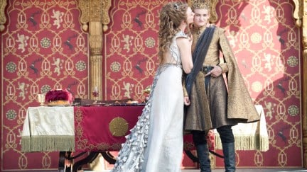 Newlyweds Joffrey Baratheon and Margaery Tyrell embrace at their wedding before it turns ugly