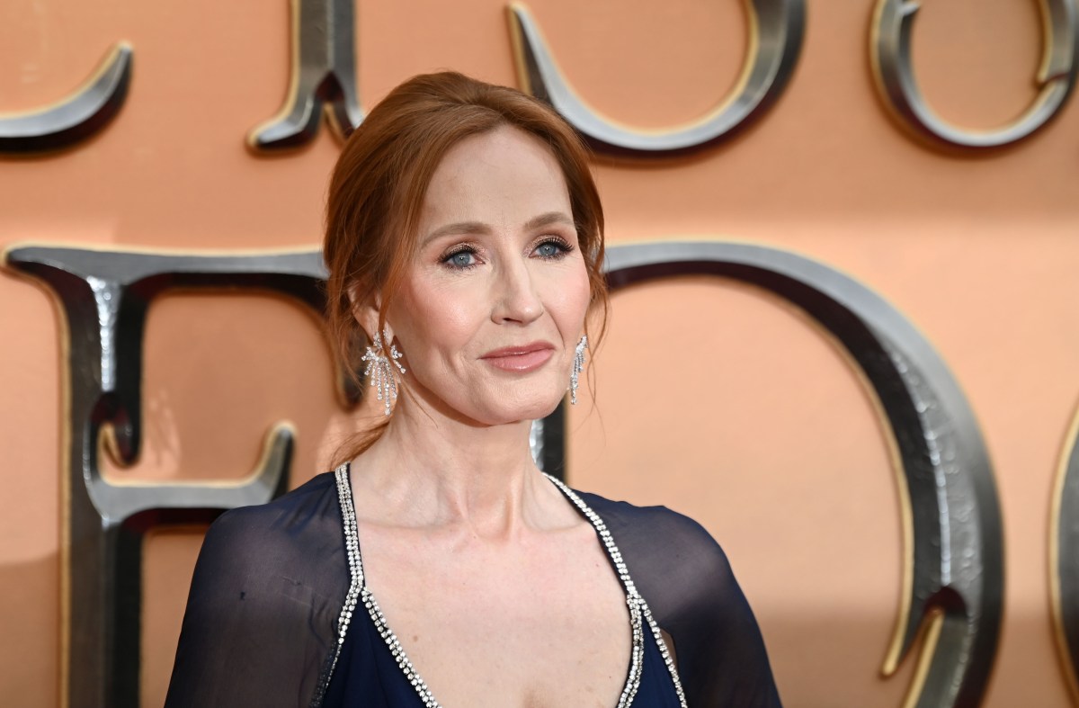 J.K. Rowling gives a tense smile on a red carpet