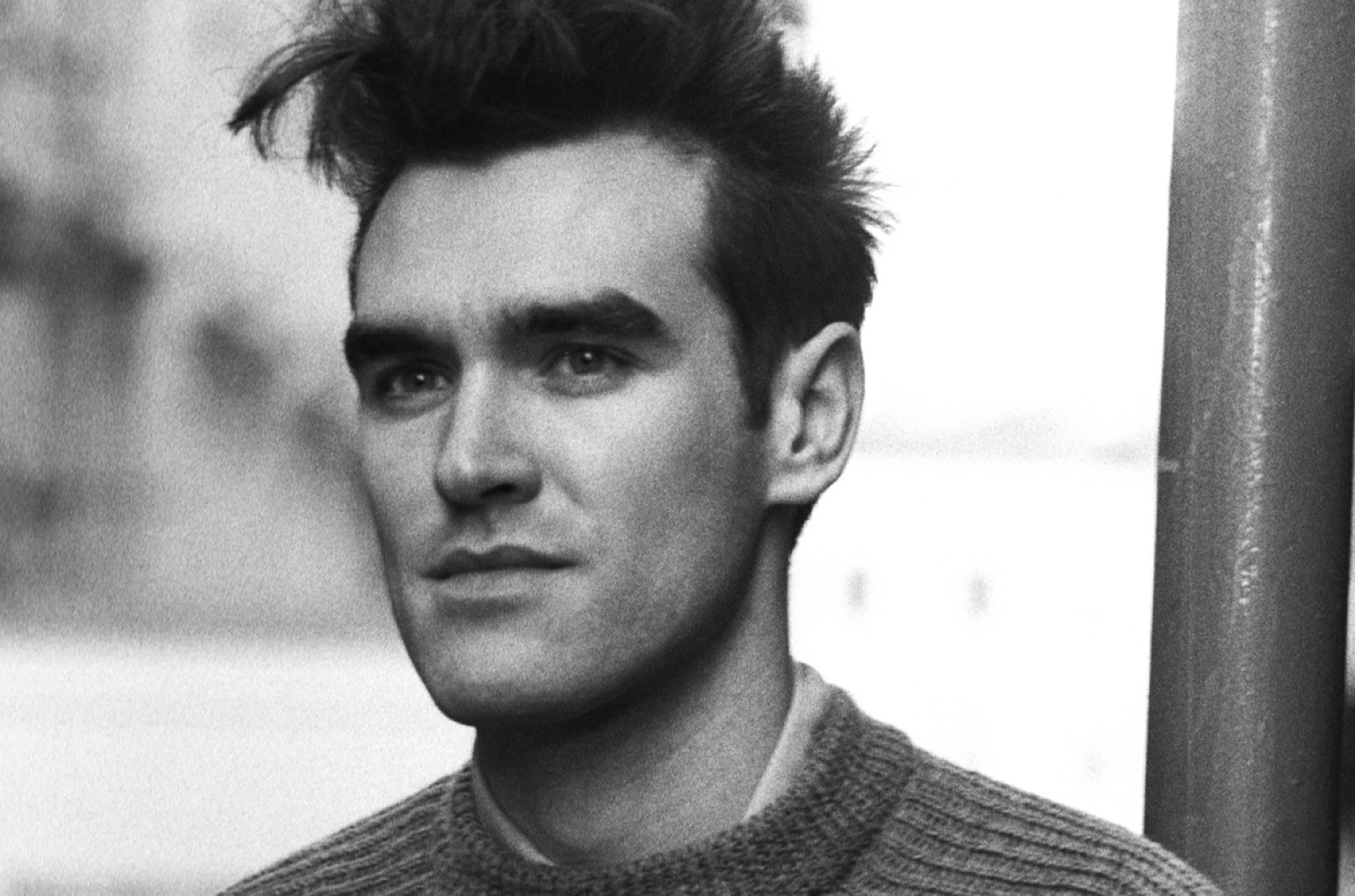 Classic black and white headshot of the singer Morrissey.
