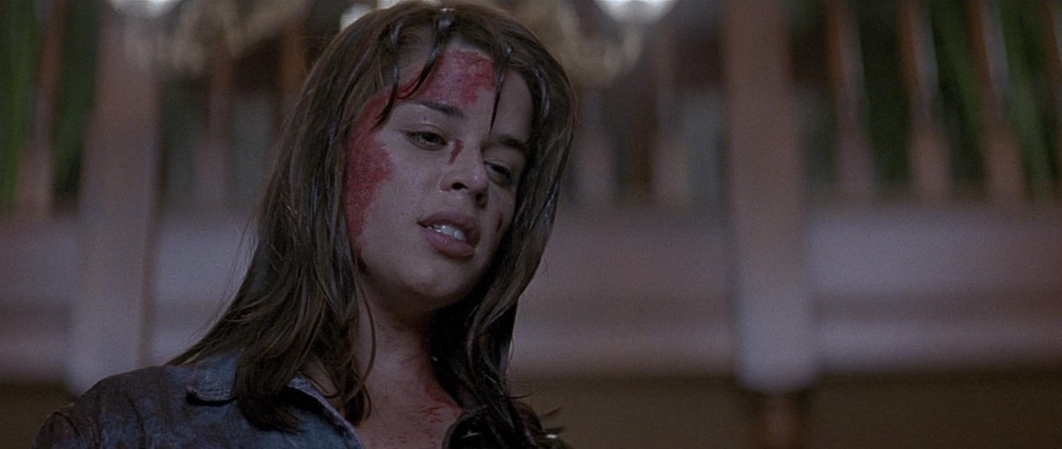 Sidney Prescott (Neve Campbell) with blood on her face after a rough night in 'Scream'