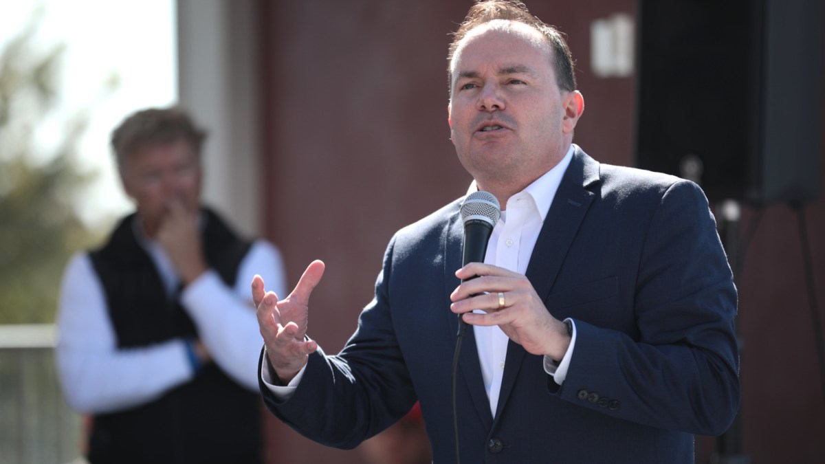 Senator Mike Lee, with Senator Rand Paul in the background.