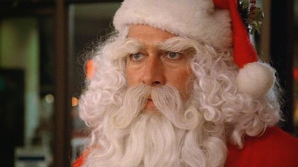 Christopher Plummer dressed as Santa Claus